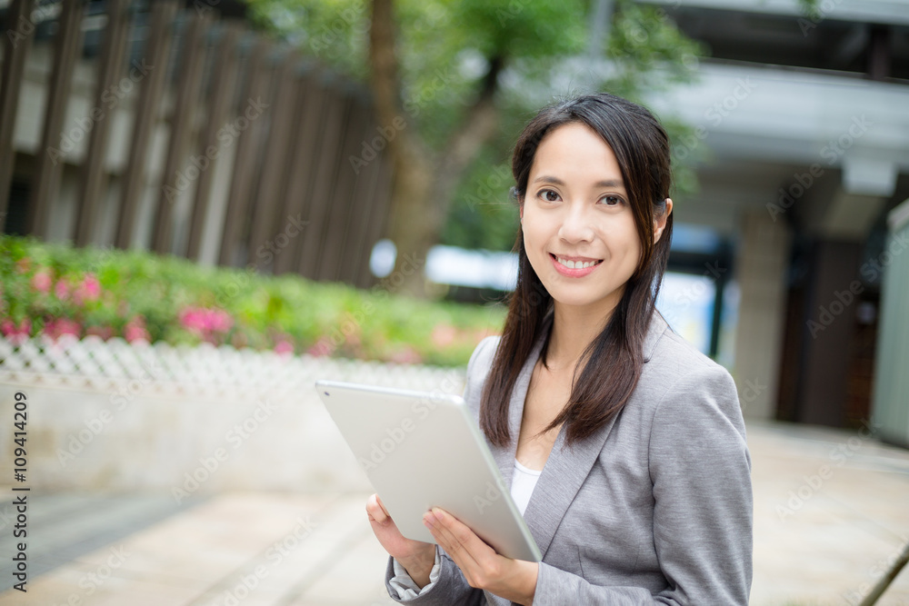 Businesswoman use of tablet pc Businesswoman use of tablet pc