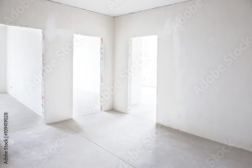 White room with tree entrances