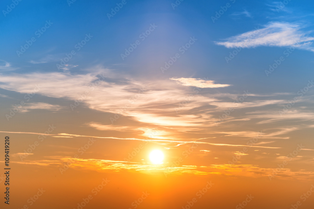 Sunset in the sky with blue orange clouds