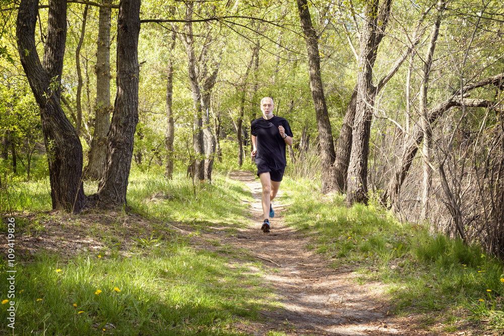Senior Man Running in the Forest Senior Man Running in the Forest