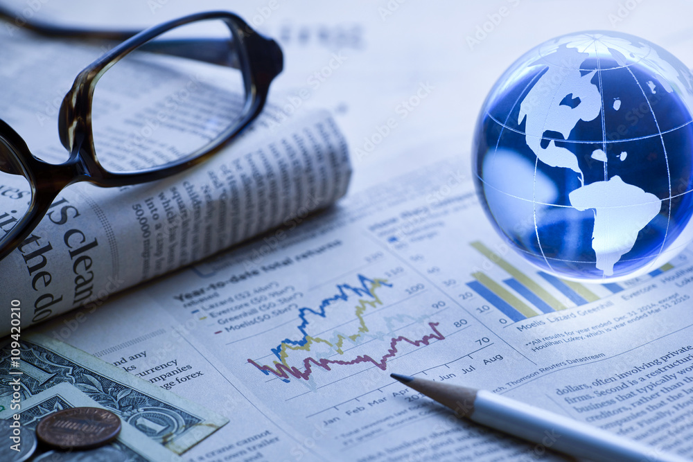 Global Business and Finance with Newspaper,blue toned Global Business and Finance with Newspaper,blue toned