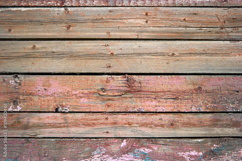 Rustic weathered barn wood background painted in red color Rustic weathered barn wood background painted in red color