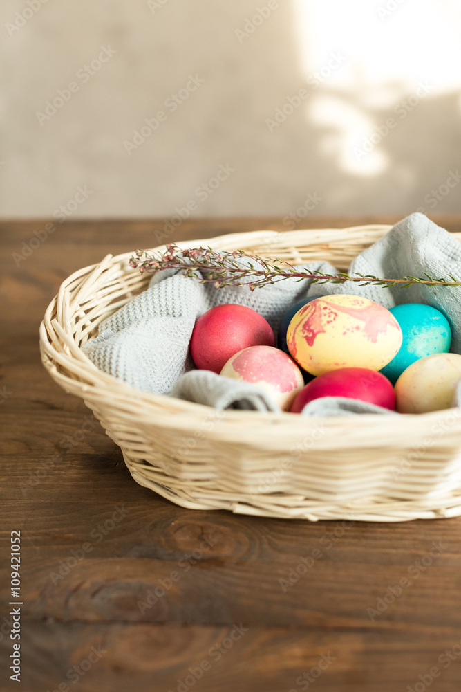 Colored Easter eggs in basket
