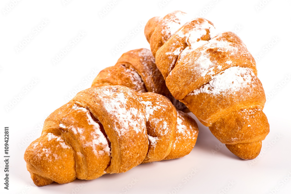 pile of fresh and delicious kroissants and rolls on a white back pile of fresh and delicious kroissants and rolls on a white back