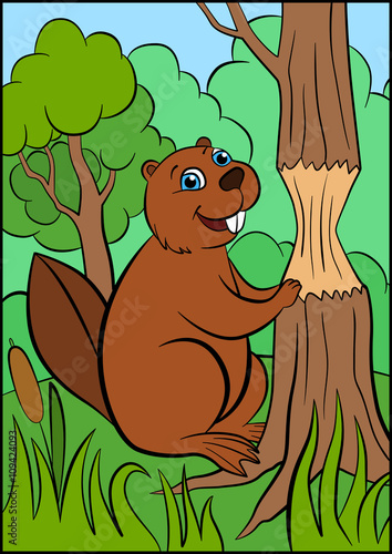 Little cute beaver stands near the tree.