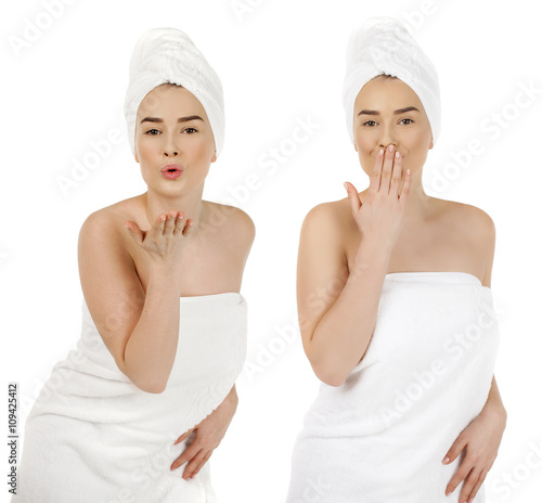 Young woman in white towel blowing while sending an air kiss