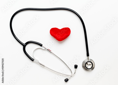 stethoscope on white background with plush heart
