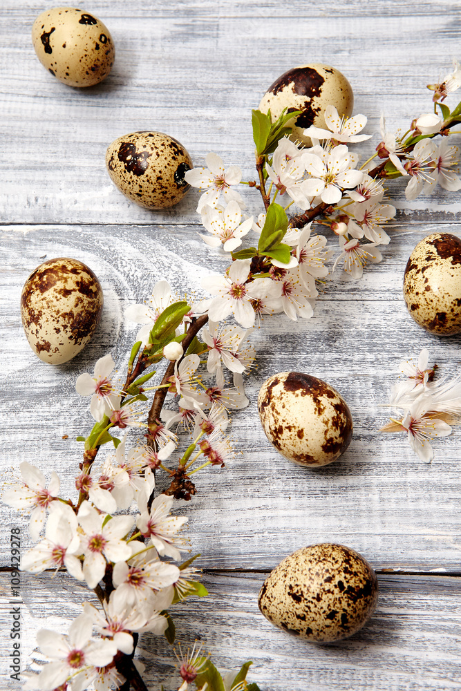 Spring easter composition with eggs and flowers on a gray old wooden background Spring easter composition with eggs and flowers on a gray old wooden background