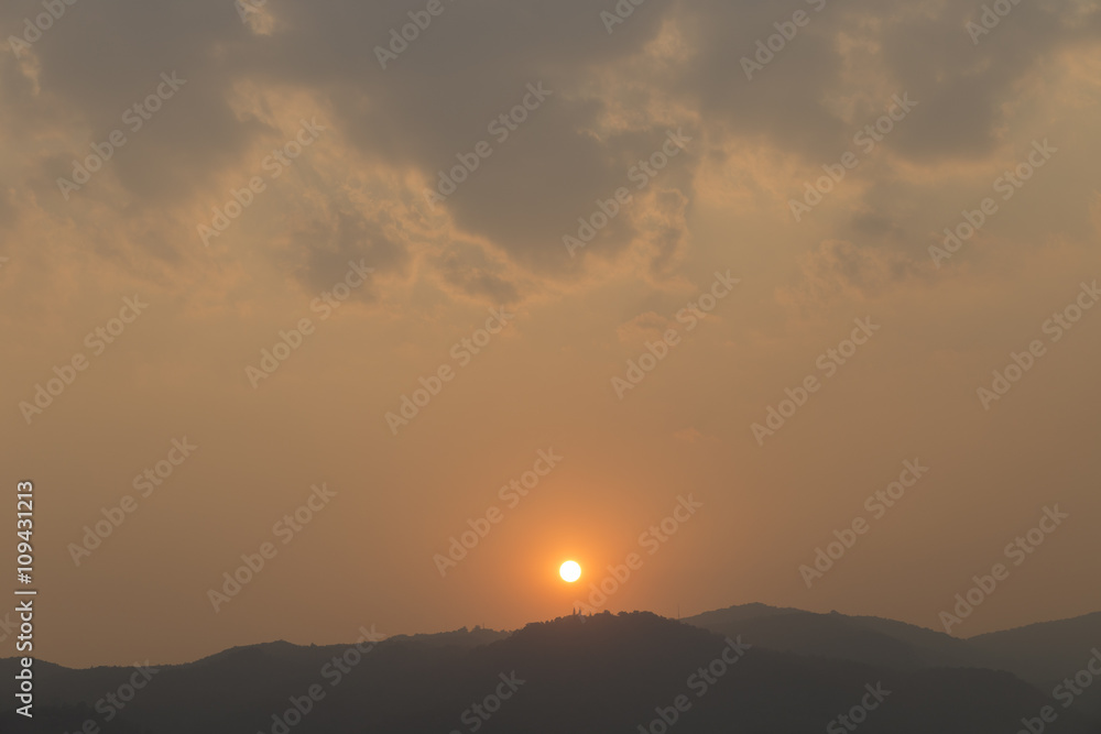 sunset on mountain hill