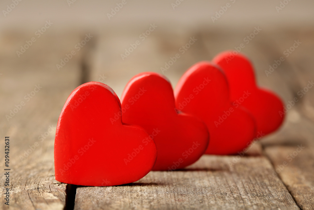 Fototapeta premium Wooden hearts on rustic wooden background