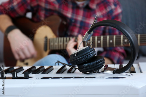 Photography Man with guitar and synthesizer closeup