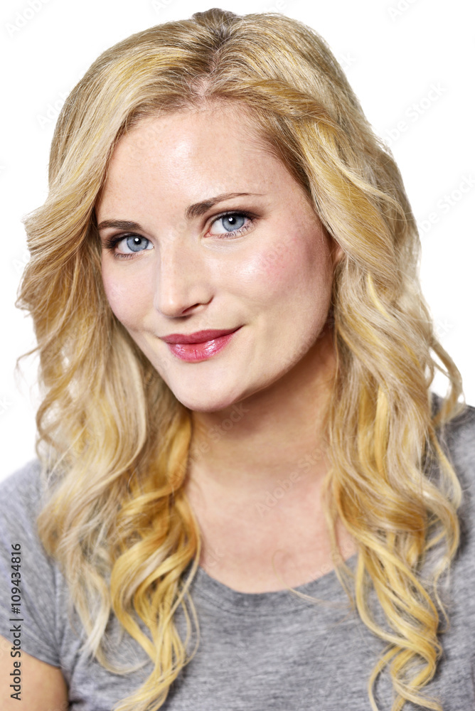 Beautiful blond woman looking into the camera. Positive Emotions. Young woman with copy space, isolated on white background. Beautiful blond woman looking into the camera. Positive Emotions. Young woman with copy space, isolated on white background.