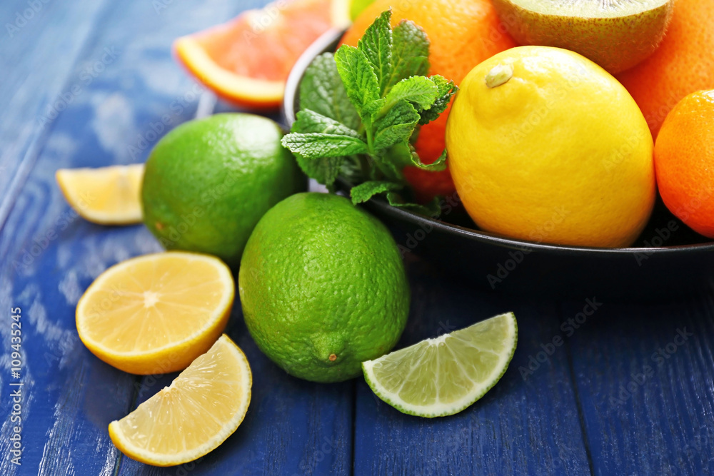Juicy composition of tropical fruits in a bowl, close up