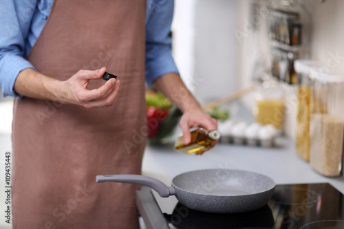 Man cooking in kitchen