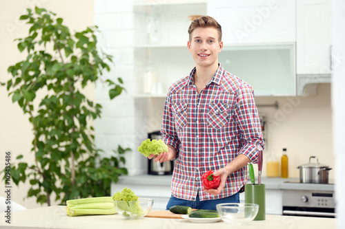 Happy handsome man with veg...