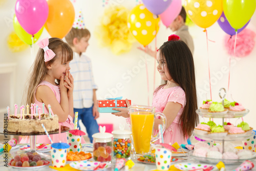 Happy little girl presentin...