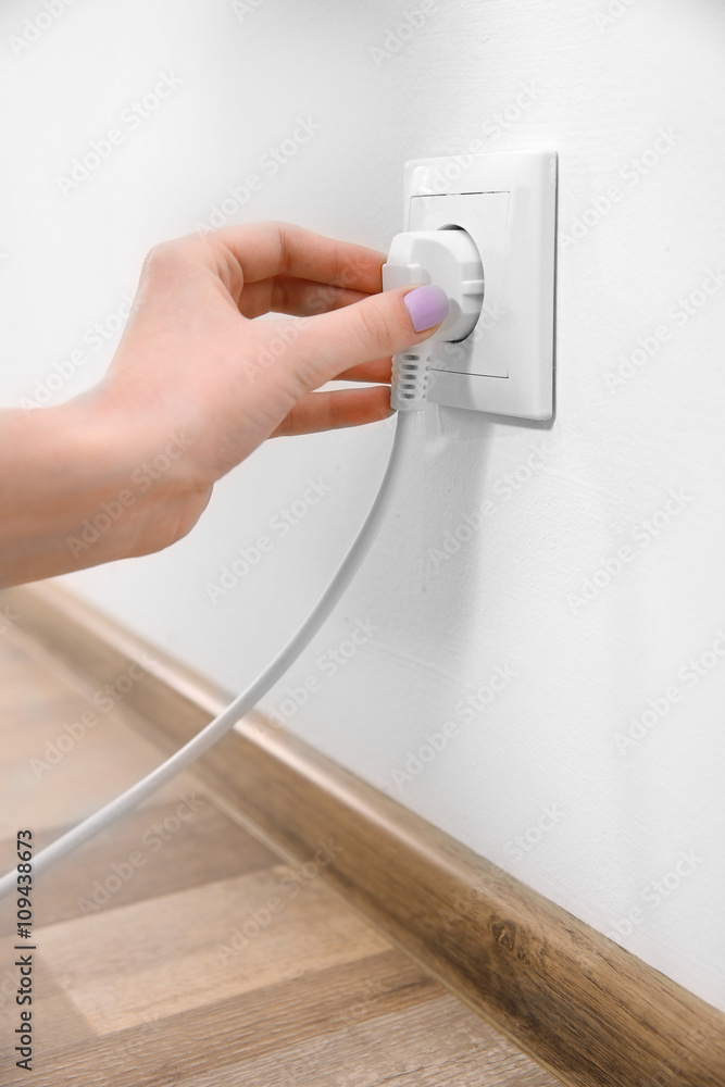 Woman with power outlet and plug Woman with power outlet and plug
