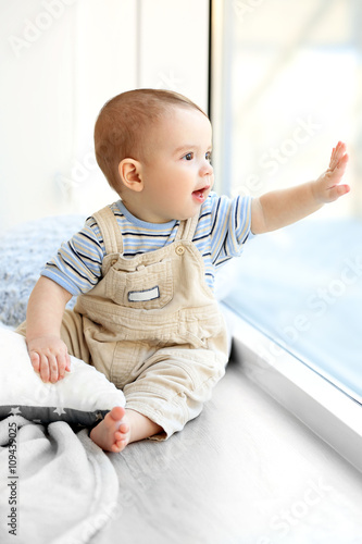 Little baby boy looking out...
