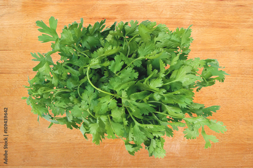 Parsley on wooden cutting board Parsley on wooden cutting board