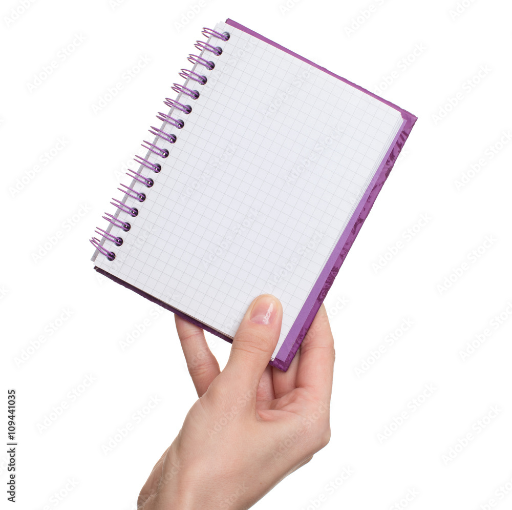 female hand holding a blank notebook female hand holding a blank notebook