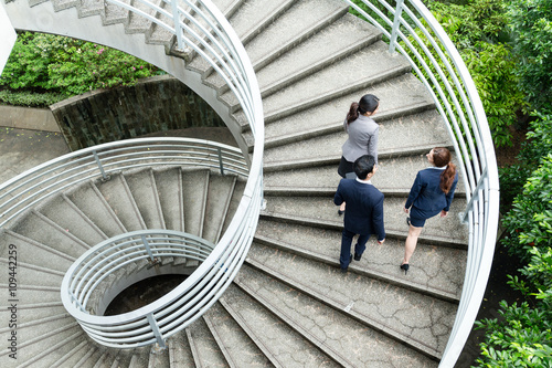 фотографія Group of business people walking upstairs