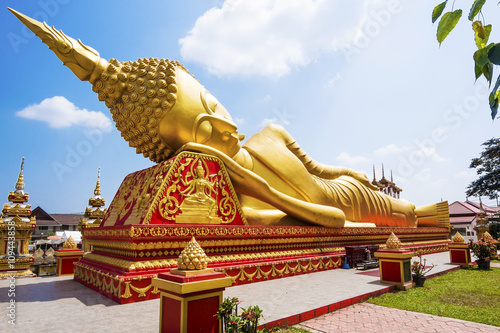 Reclining Buddha statue at Wat Pha That Luang, Vientiane, Laos. photo