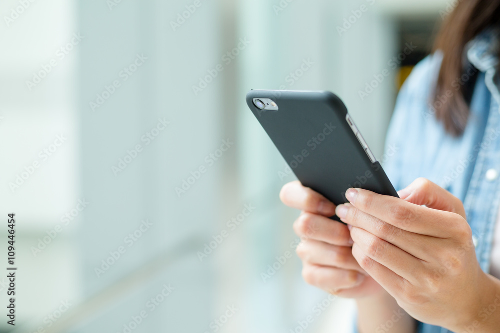 Woman use of cellphone at indoor Woman use of cellphone at indoor