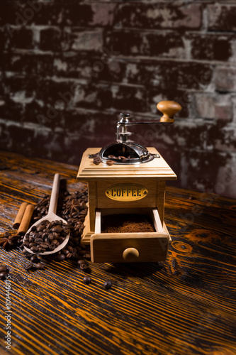 Roasted Coffee Beans, Wood Spoon and Hand Grinder