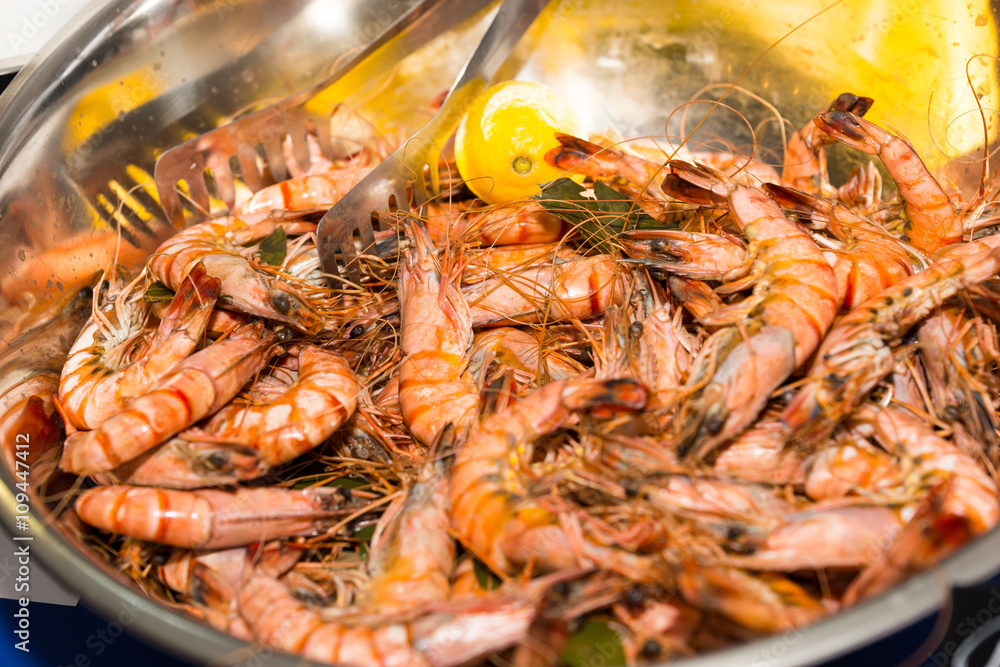 Metal Bowl Filled with Cooked Prawns and Lemon Metal Bowl Filled with Cooked Prawns and Lemon