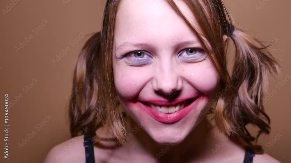 Scary teen girl looking angry and have a sinister laugh. 4K UHD Scary teen girl looking angry and have a sinister laugh. 4K UHD