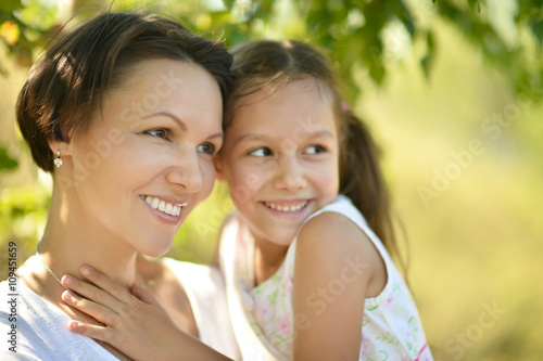 girl with mother in park