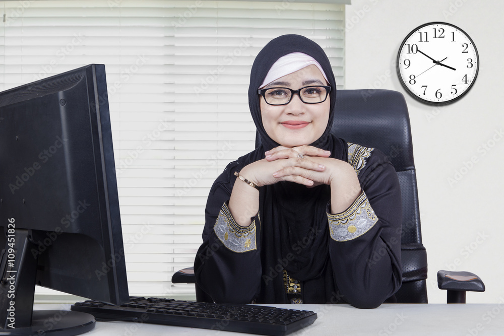 Pretty Arabic woman smiling in the office Pretty Arabic woman smiling in the office