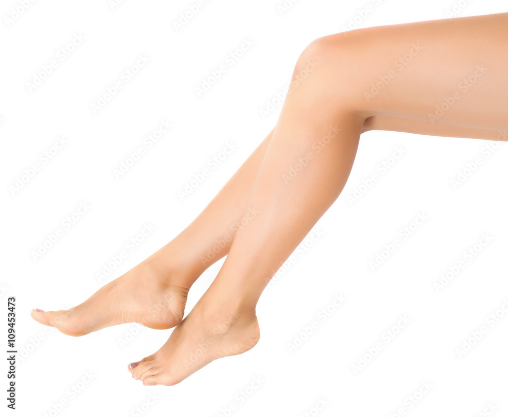 Woman legs isolated on white. Depilation or another healths concept Woman legs isolated on white. Depilation or another healths concept