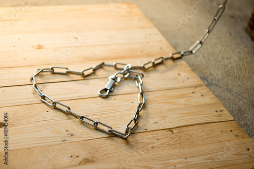 soft focus heart-shaped Chains on the wooden floor