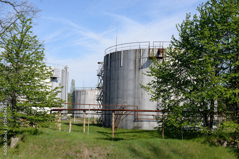 Several storage tanks for gasoline and oil Several storage tanks for gasoline and oil