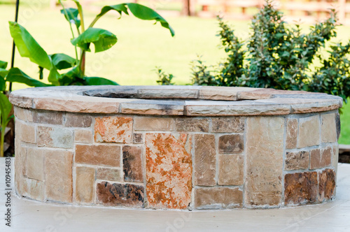 Photography Outdoor flagstone firepit with landscape in background.