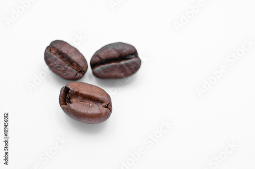 three coffee beans isolated on white background