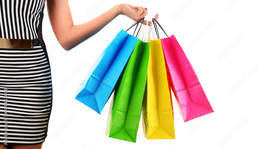 Young woman with bags in shopping mall