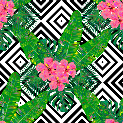 Seamless summer pattern with exotic tropical hibiskus flower and palm leaves vector background. Perfect for wallpapers, pattern fills, web page backgrounds, surface textures, textile