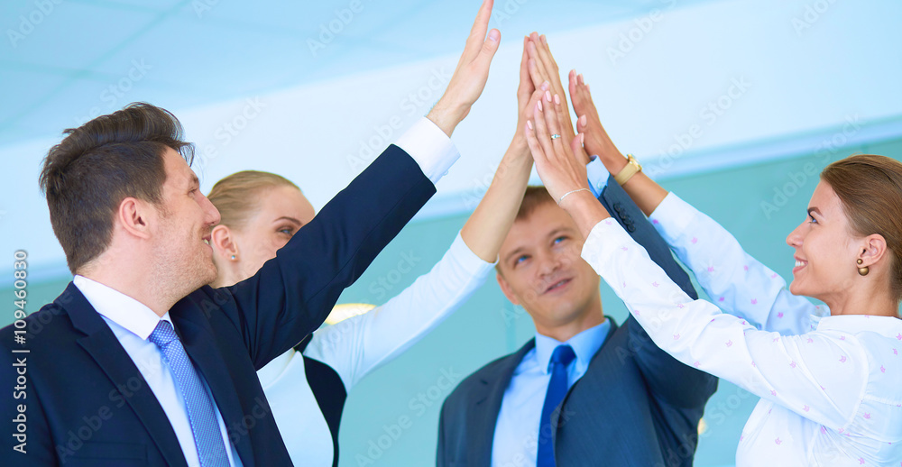 Business people with their hands together in a circle Business people with their hands together in a circle