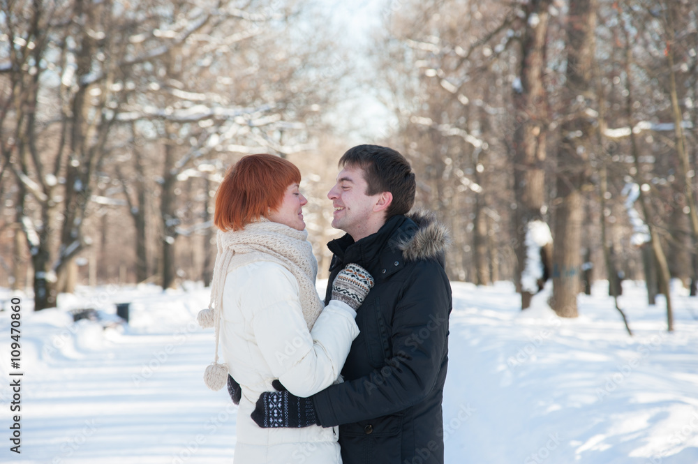 Happy couple hug in park Happy couple hug in park