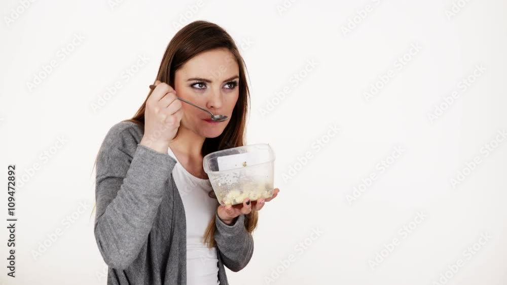 Woman eat oatmeal with dry fruits. Dieting 4K.