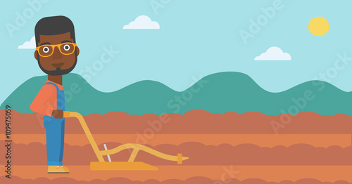Farmer on the field with plough.