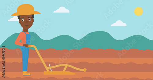 Farmer on the field with plough.