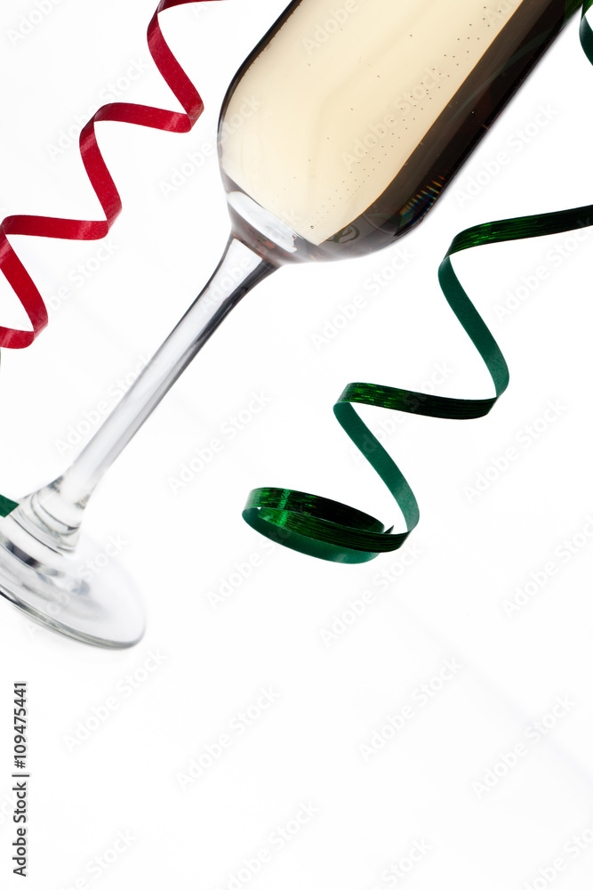 cropped image of a champagne flute with streamers. cropped image of a champagne flute with streamers.