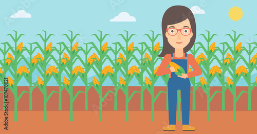 Farmer holding corn.