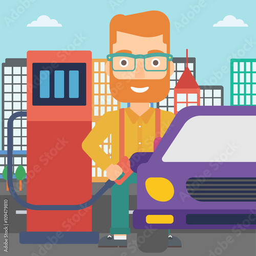 Man filling up fuel into car.
