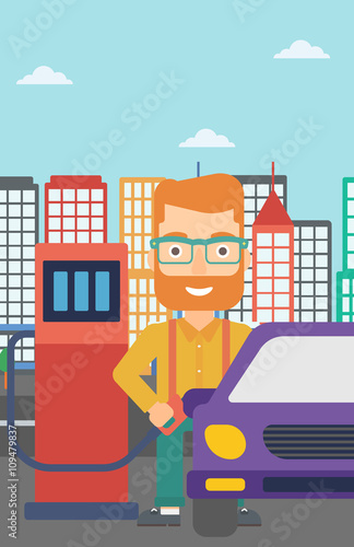 Man filling up fuel into car.