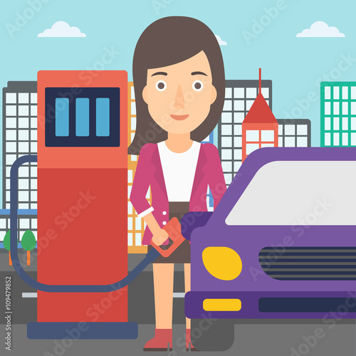 Woman filling up fuel into car.