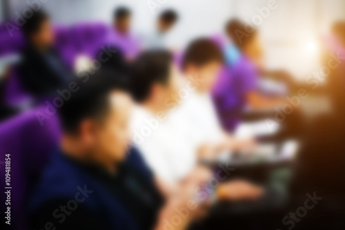 Blur image of peoples on the conference rooms in the University and light